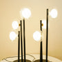 Modern black triple rod lamp pair
