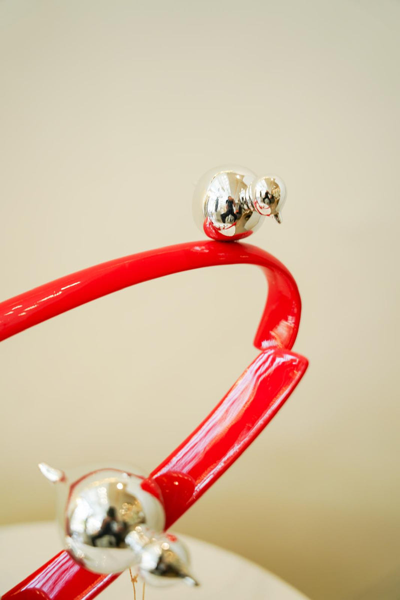 Red Orbit with silver birds